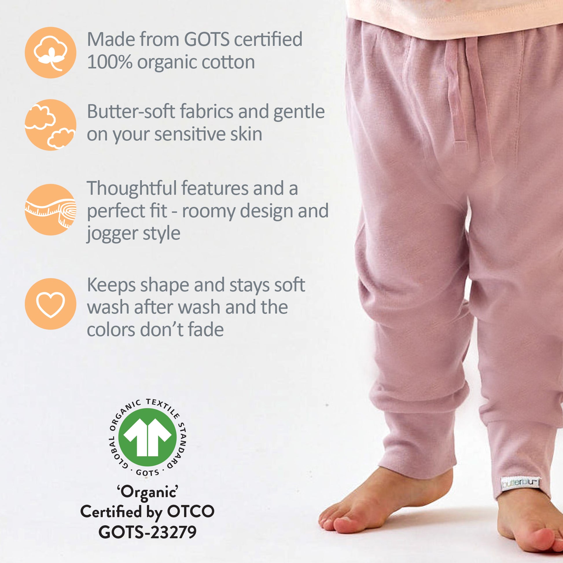 Pink kids pants with GOTS certification details on a white background