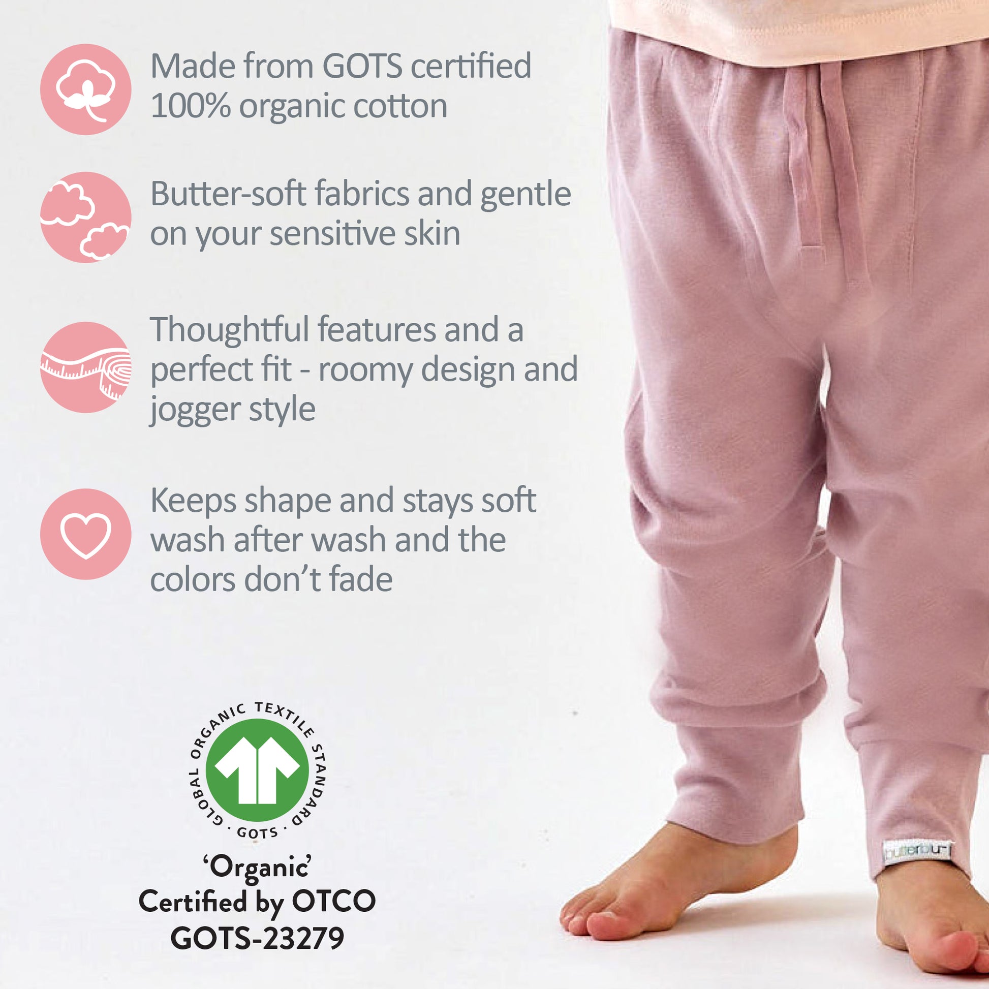 Pink pajama pants with GOTS certified organic cotton features on a white background