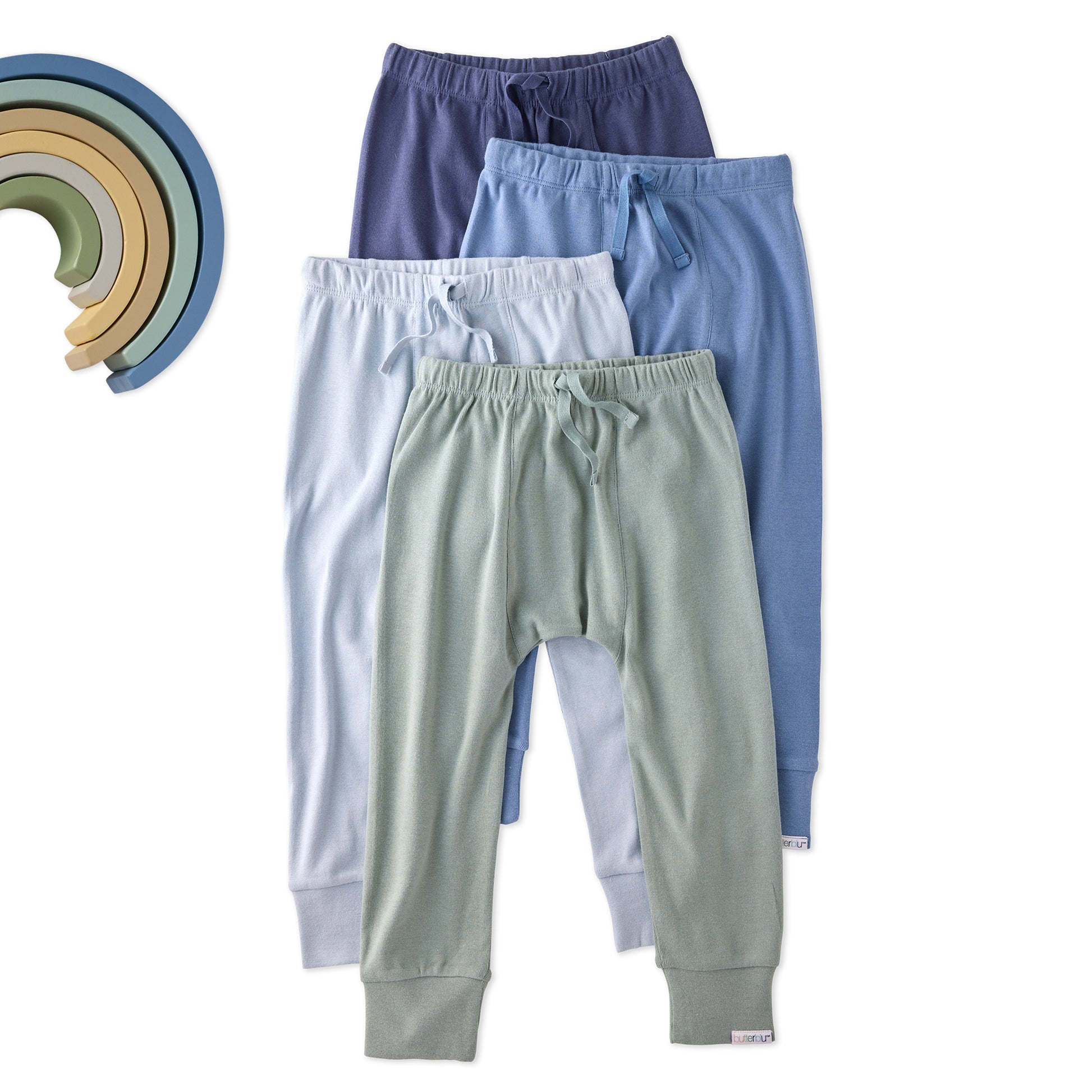 Four pairs of children's pants in different colors on a white background