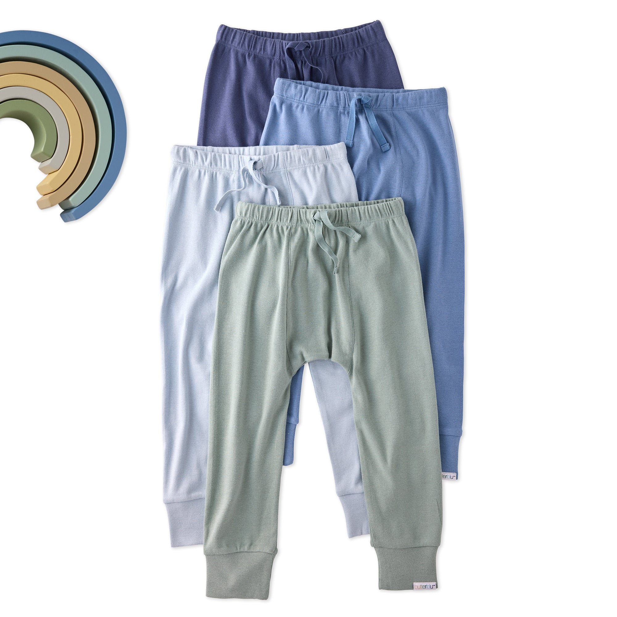 Four pairs of children's pants in different colors on a white background