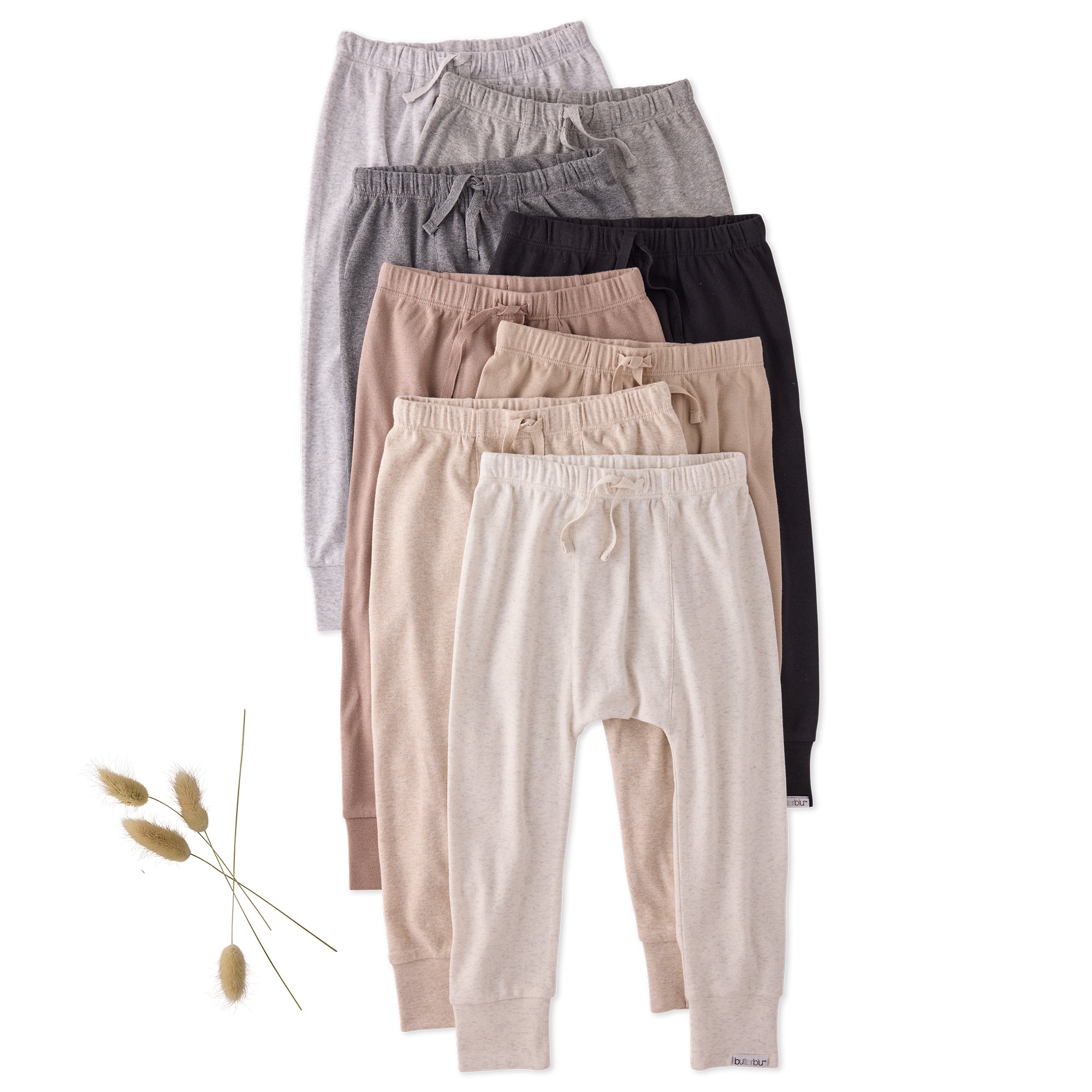 Set of five pairs of lounge pants in various colors on a white background.