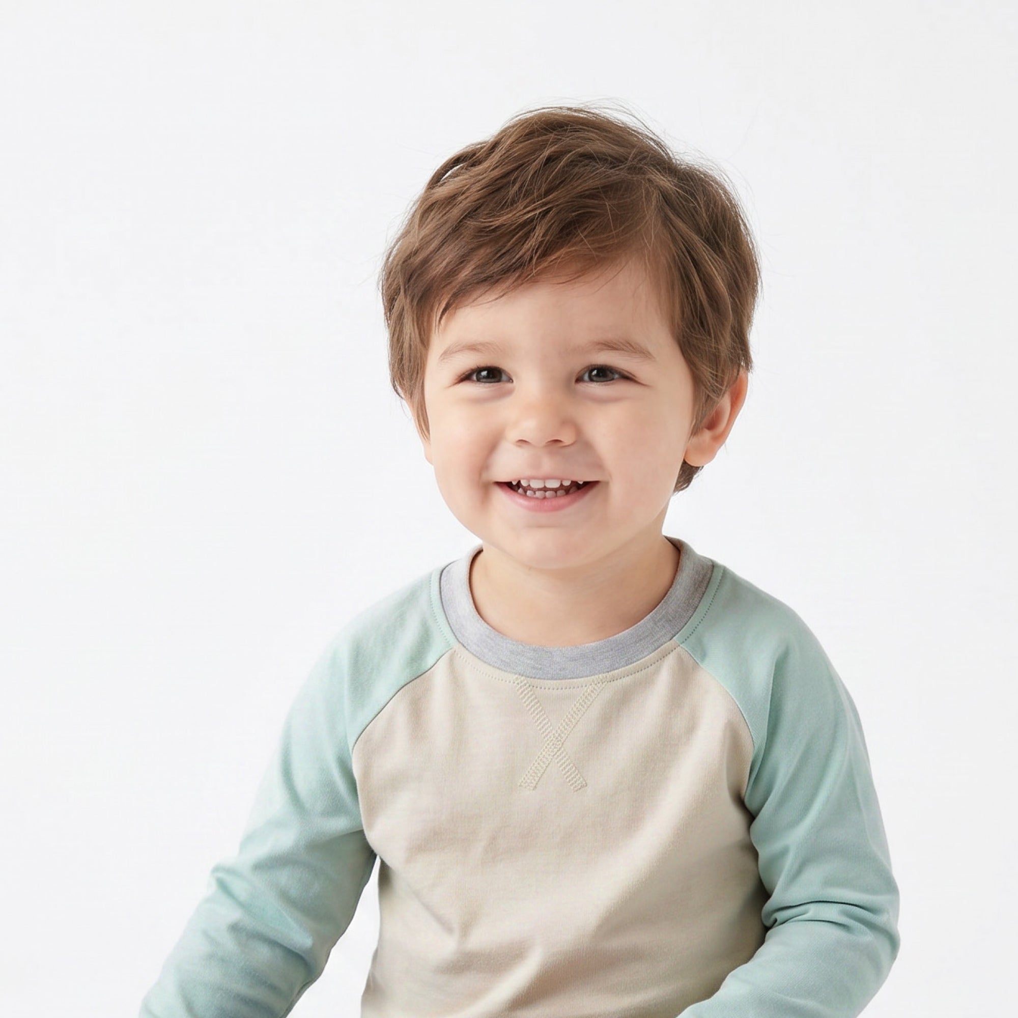 Little Boy smiling in ROOKIE baseball tee
