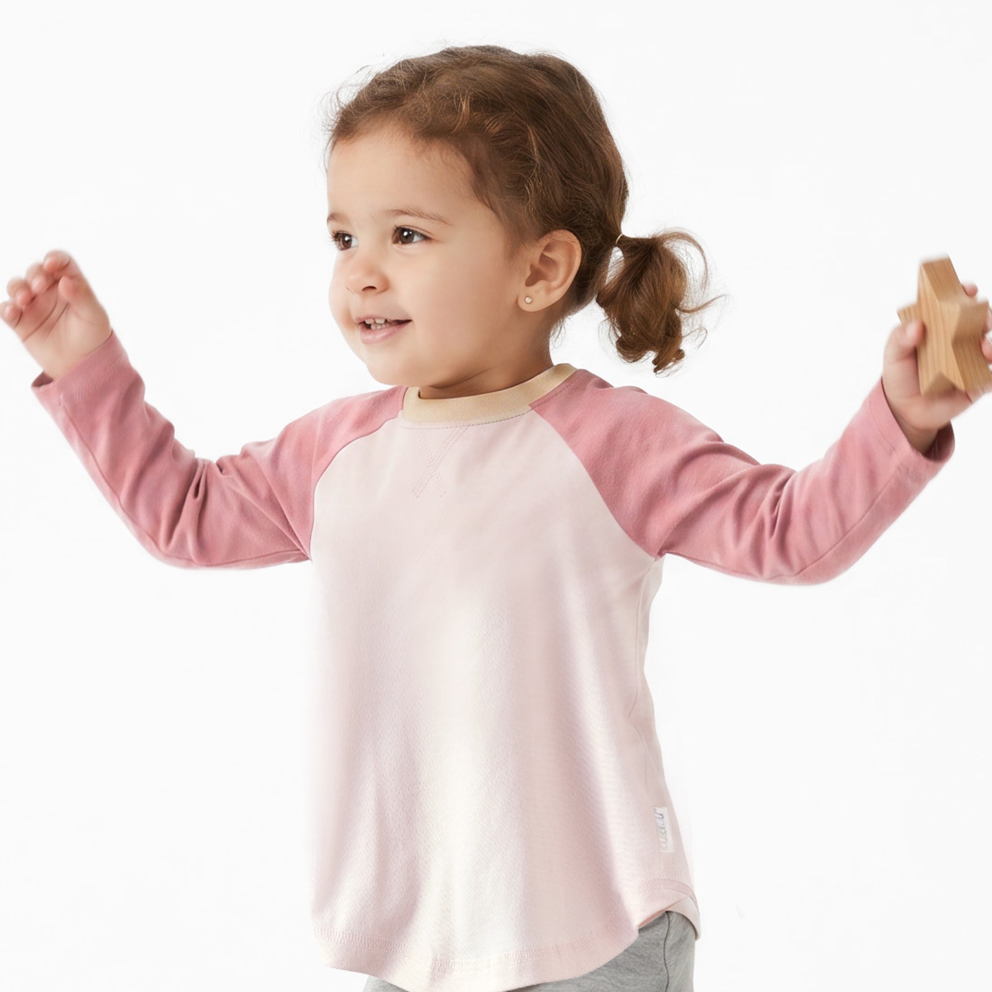 Little Girl smiling in ROOKIE baseball tee